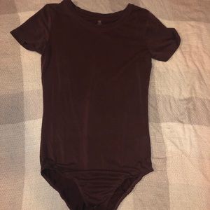 Burgundy body suit.
